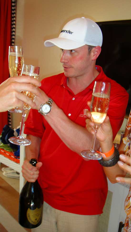 Encore Beach Club Sean Christie pours at the opening of Encore Beach Club