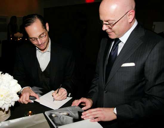 Fashion Tom Julian signs a copy of his book for menswear maestro Giorgio Canali (Photo: David X. Prutting) 